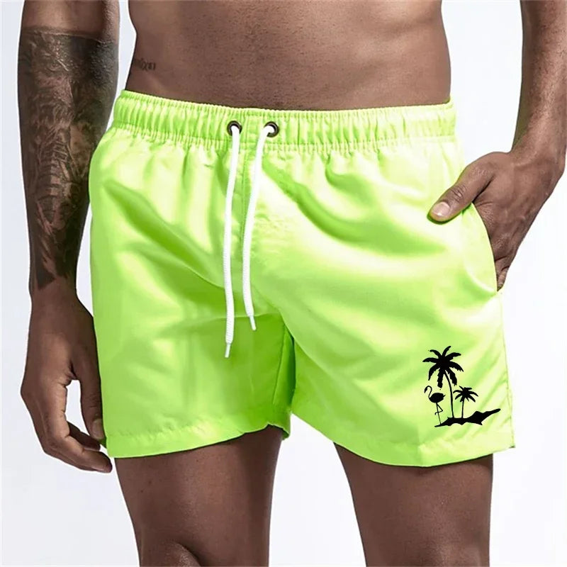 Pantalones cortos con estampado de árbol de coco y flamenco para