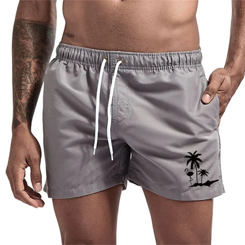 Pantalones cortos con estampado de árbol de coco y flamenco para