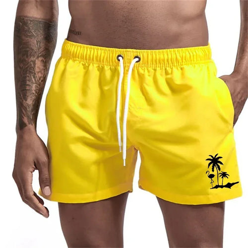 Pantalones cortos con estampado de árbol de coco y flamenco para